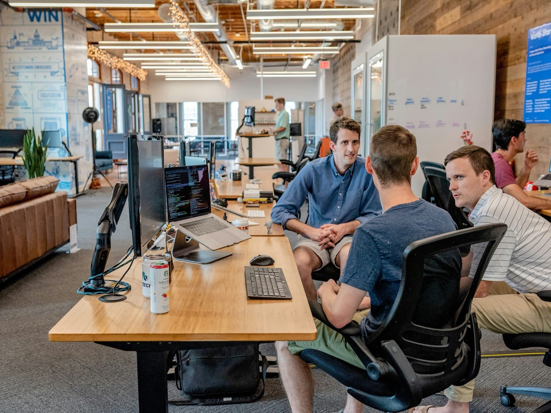 Engineers collaborating around a shared desk